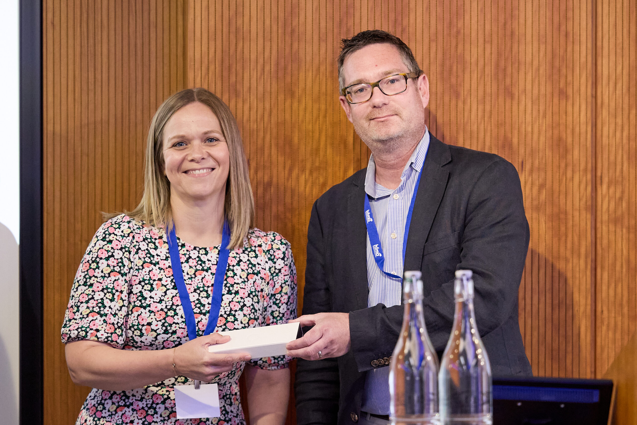 Rachel Symonds receiving the Health Journalist of the Year 2024 Awards from Steve Mann, HFMA Chair